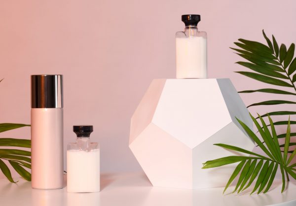 Set of cosmetic products with palm leaves